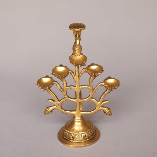 Gold menorah on a gray background
